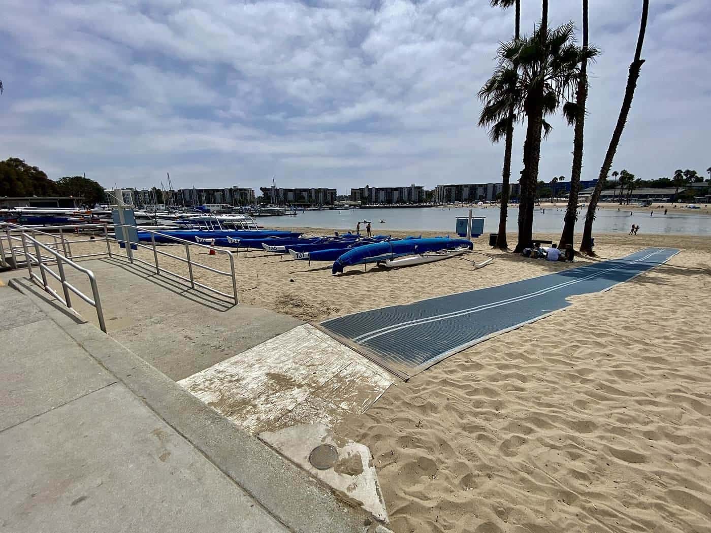 A beach accessibility mat and wheelchair ramp